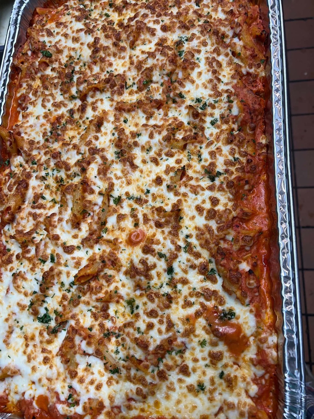 A pan of baked ziti, oven fresh