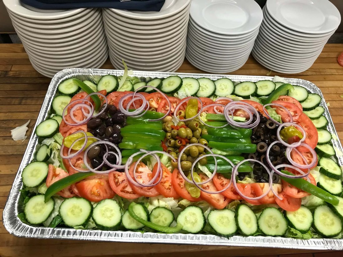 A fresh vegetable tray with dip