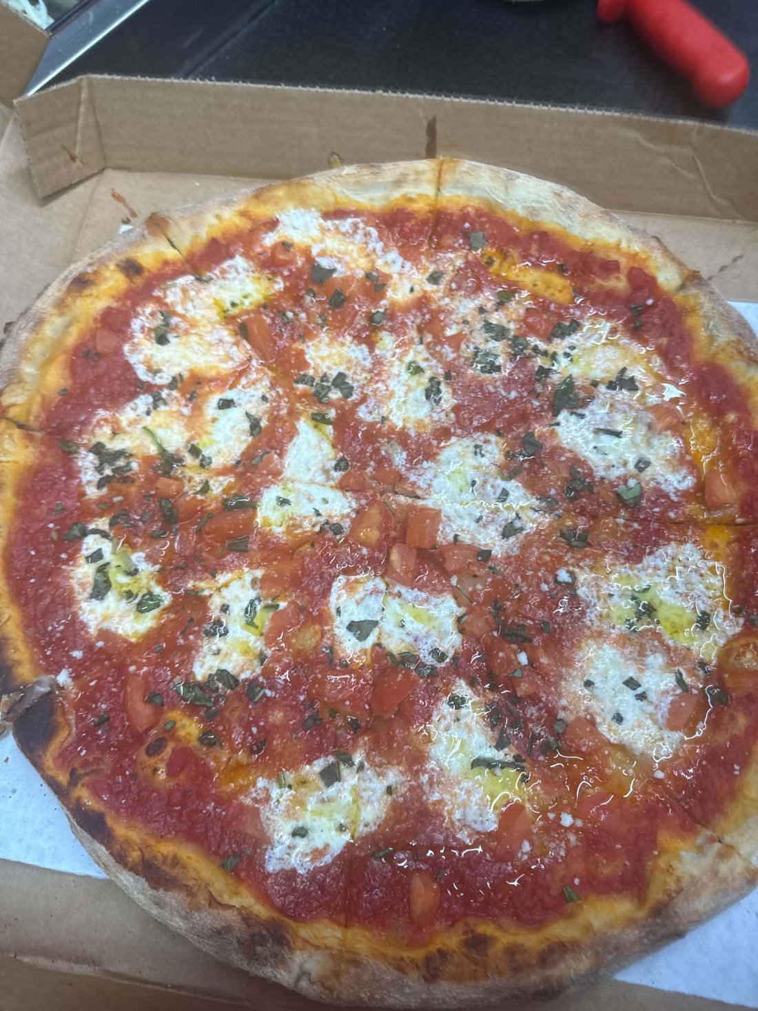 Margherita pizza with fresh mozzarella & basil