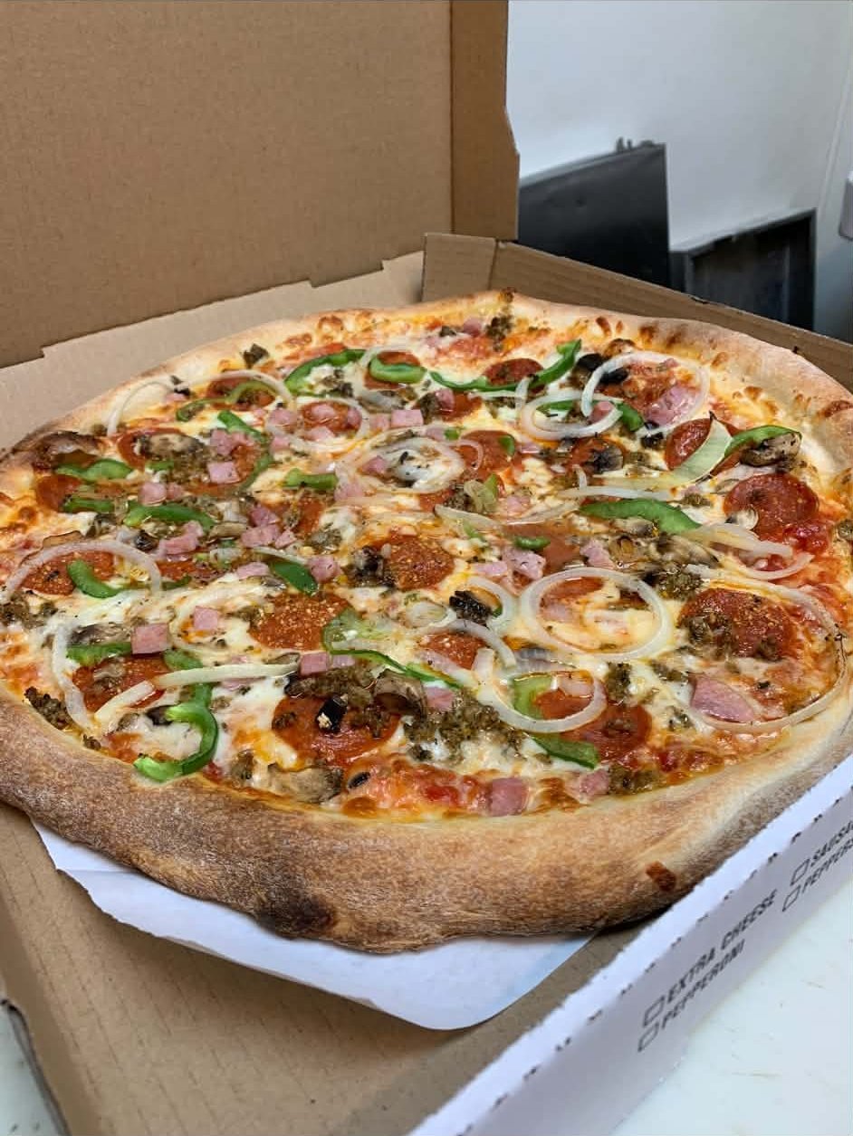 Meat lovers pizza, fresh from the oven