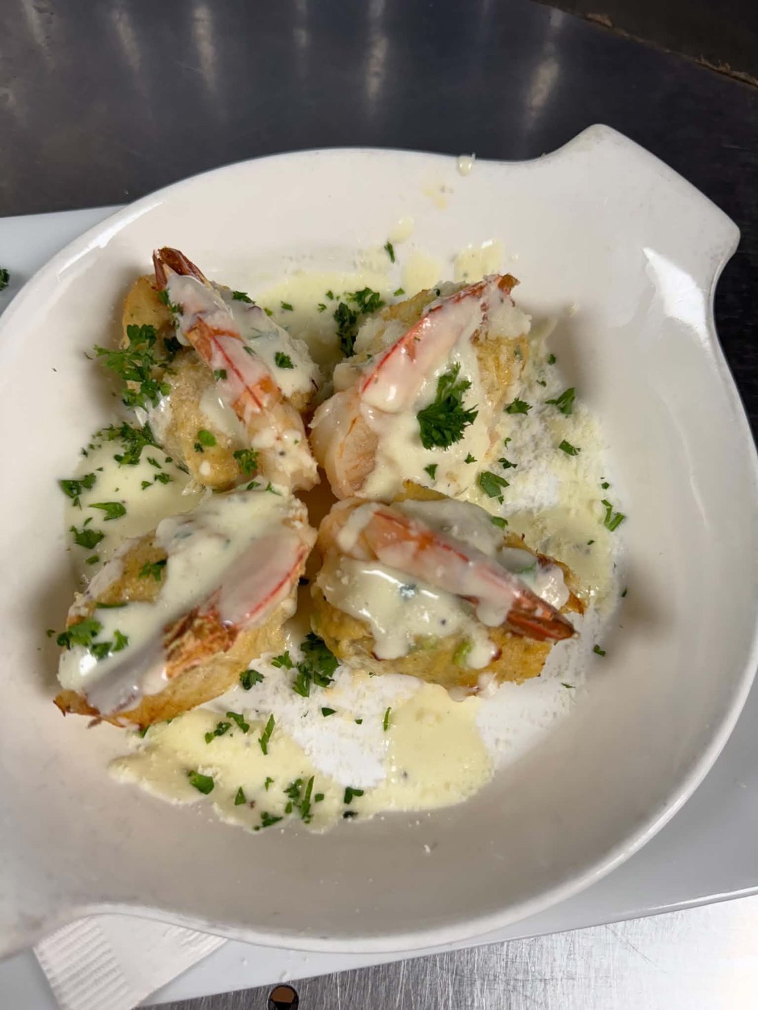 Stuffed shrimp finished with a creamy sauce